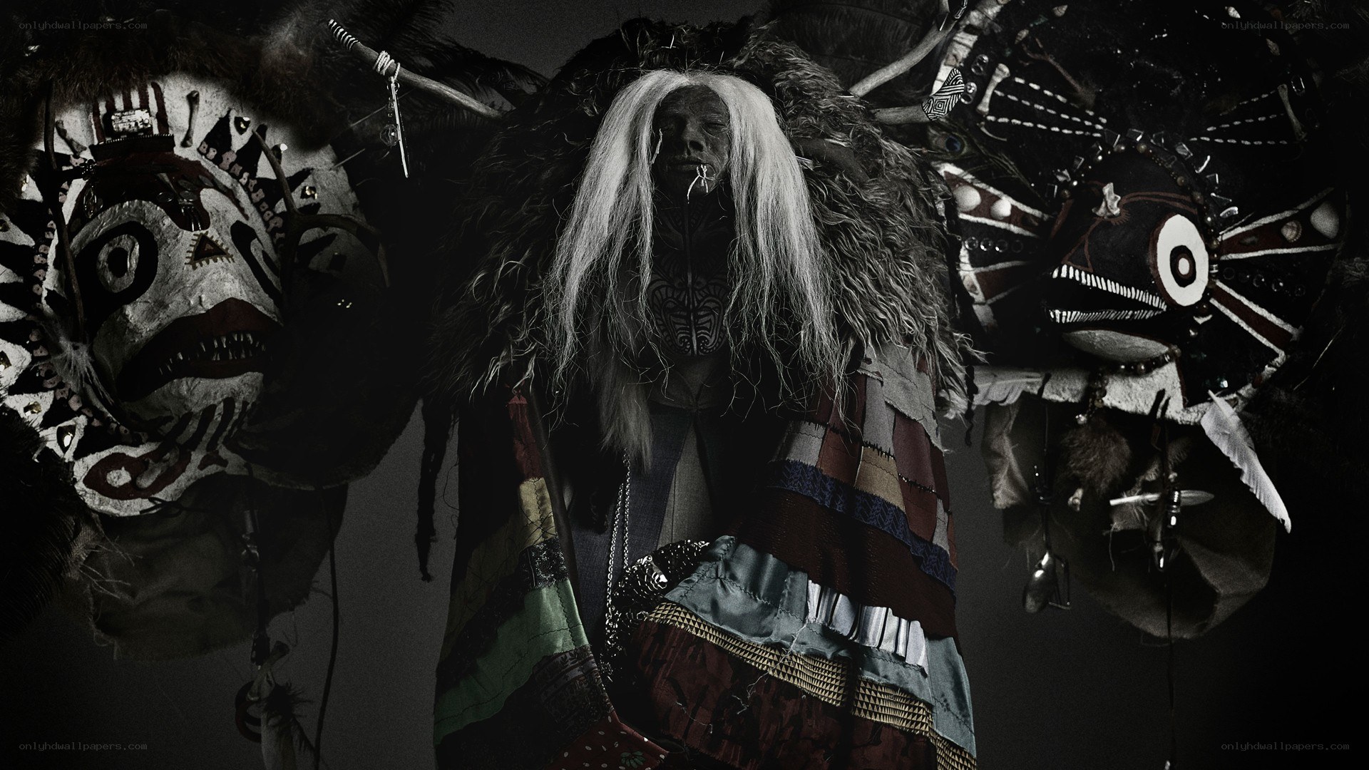 ritual figure with masks