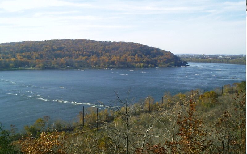 River and Forested Hill — Blue