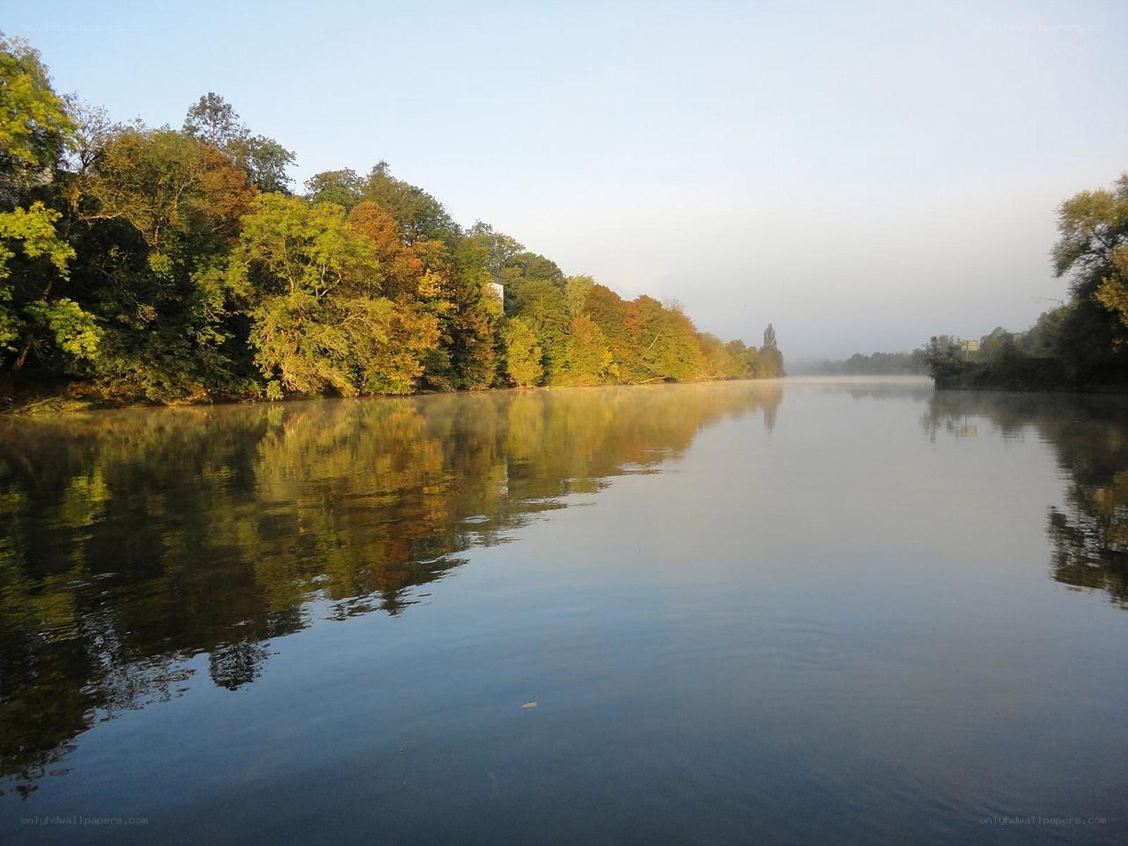 River at dawn with autumn trees