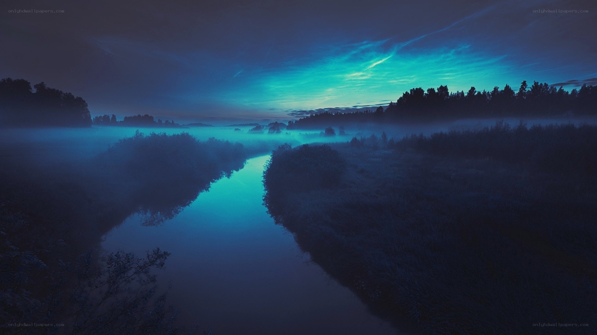 River at dawn with fog