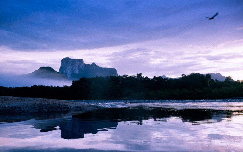 River at dawn with mountains