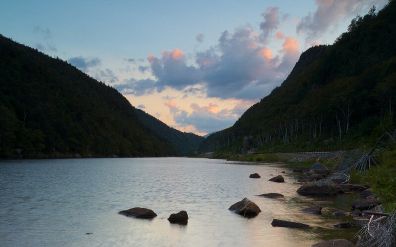 river at dusk between mountains