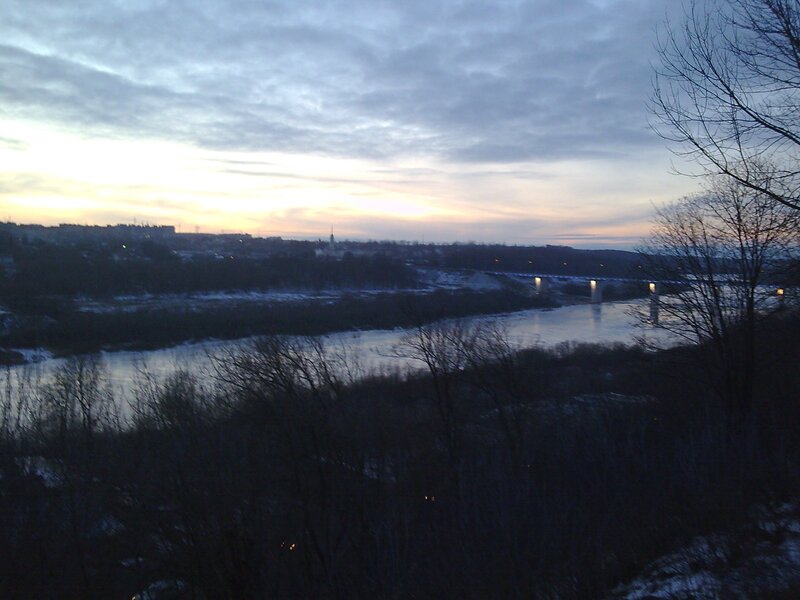 river at dusk with bridge