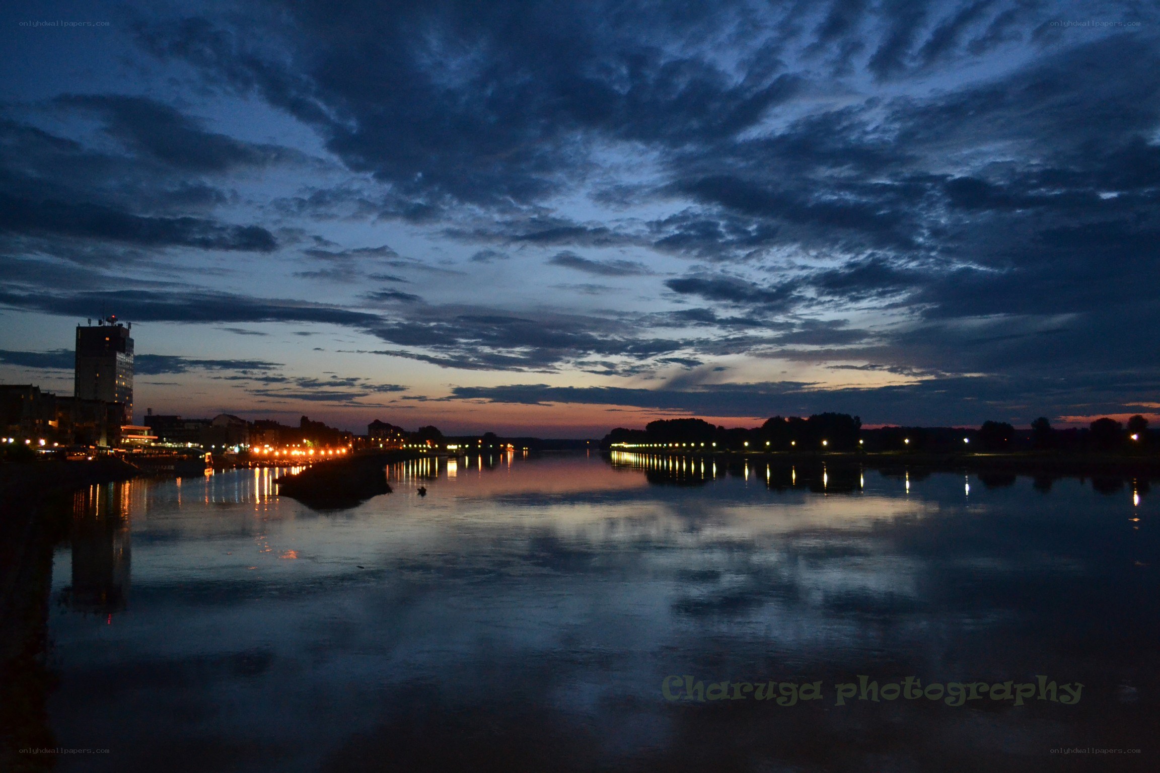River at dusk with city lights