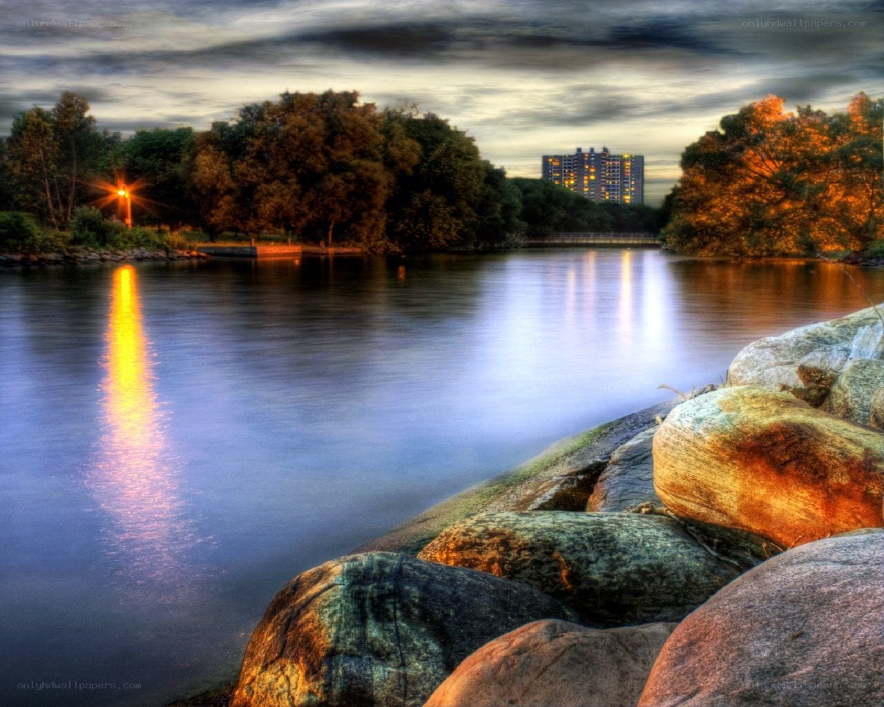 River at dusk with city view