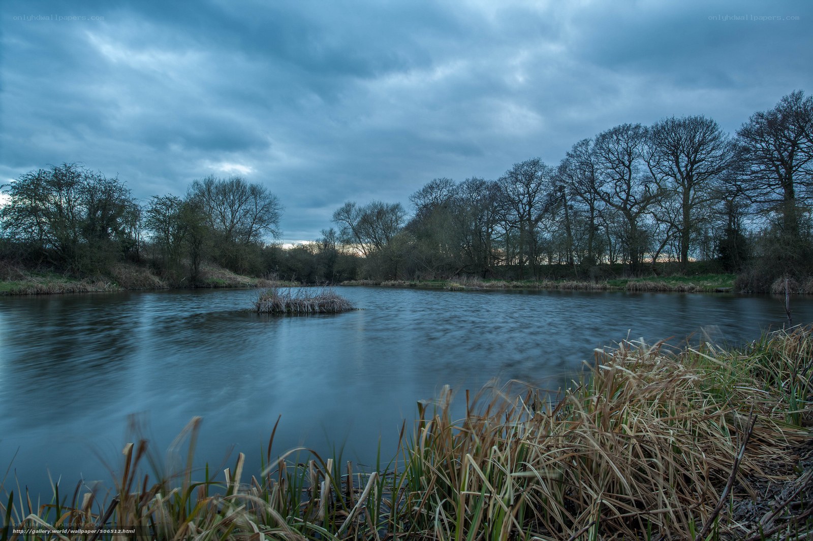 River at dusk with cloudy sky