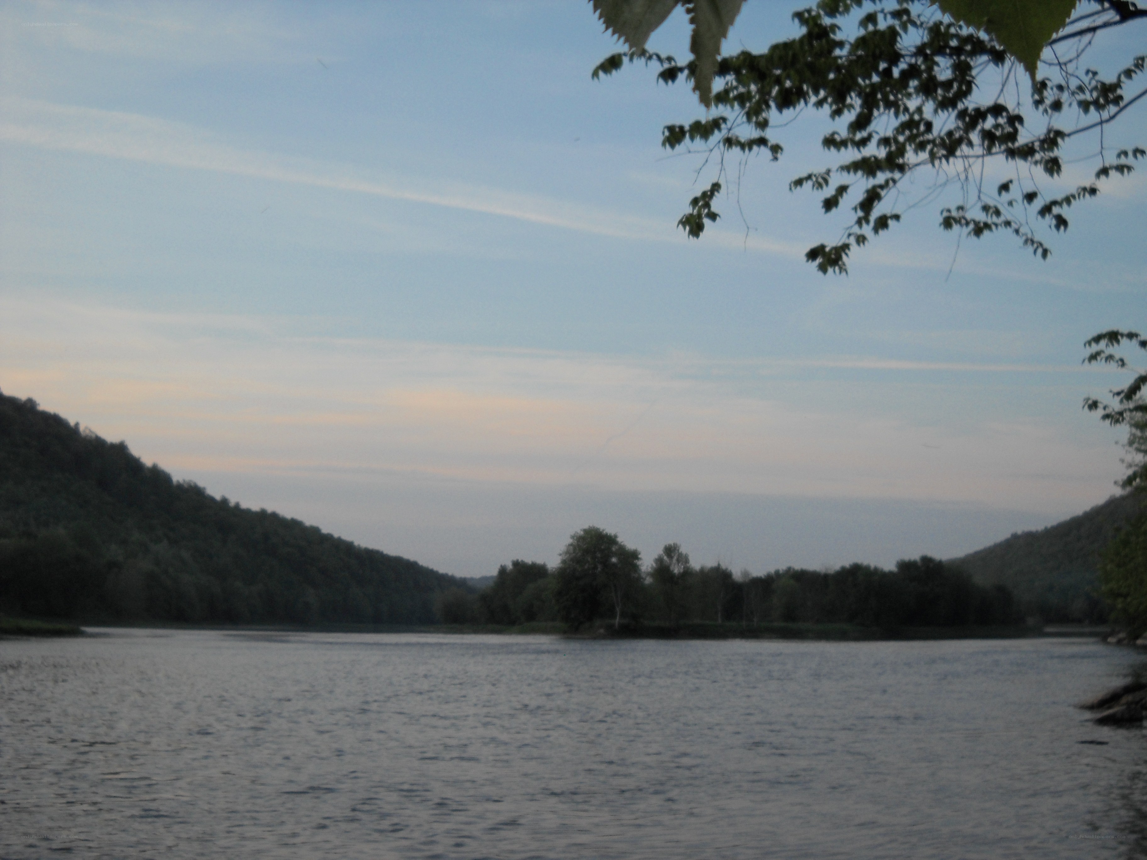 river at dusk with hills