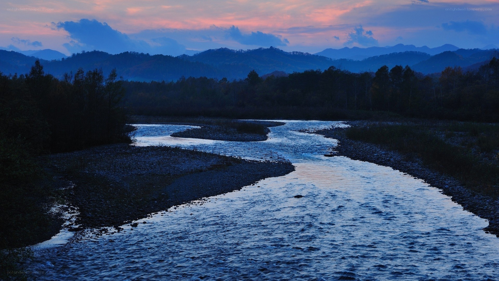river at dusk with mountains