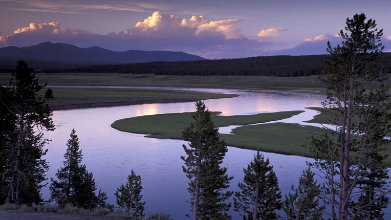 river at dusk with mountains