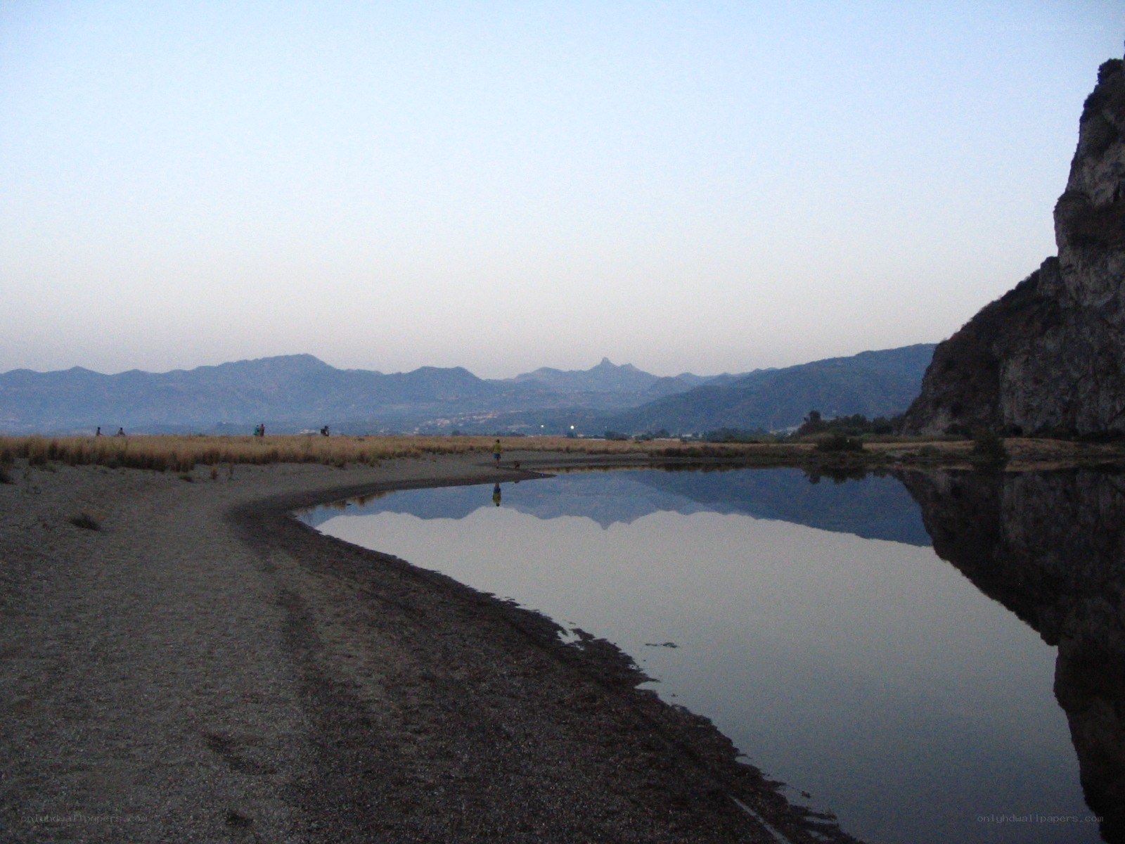 river at dusk with mountains