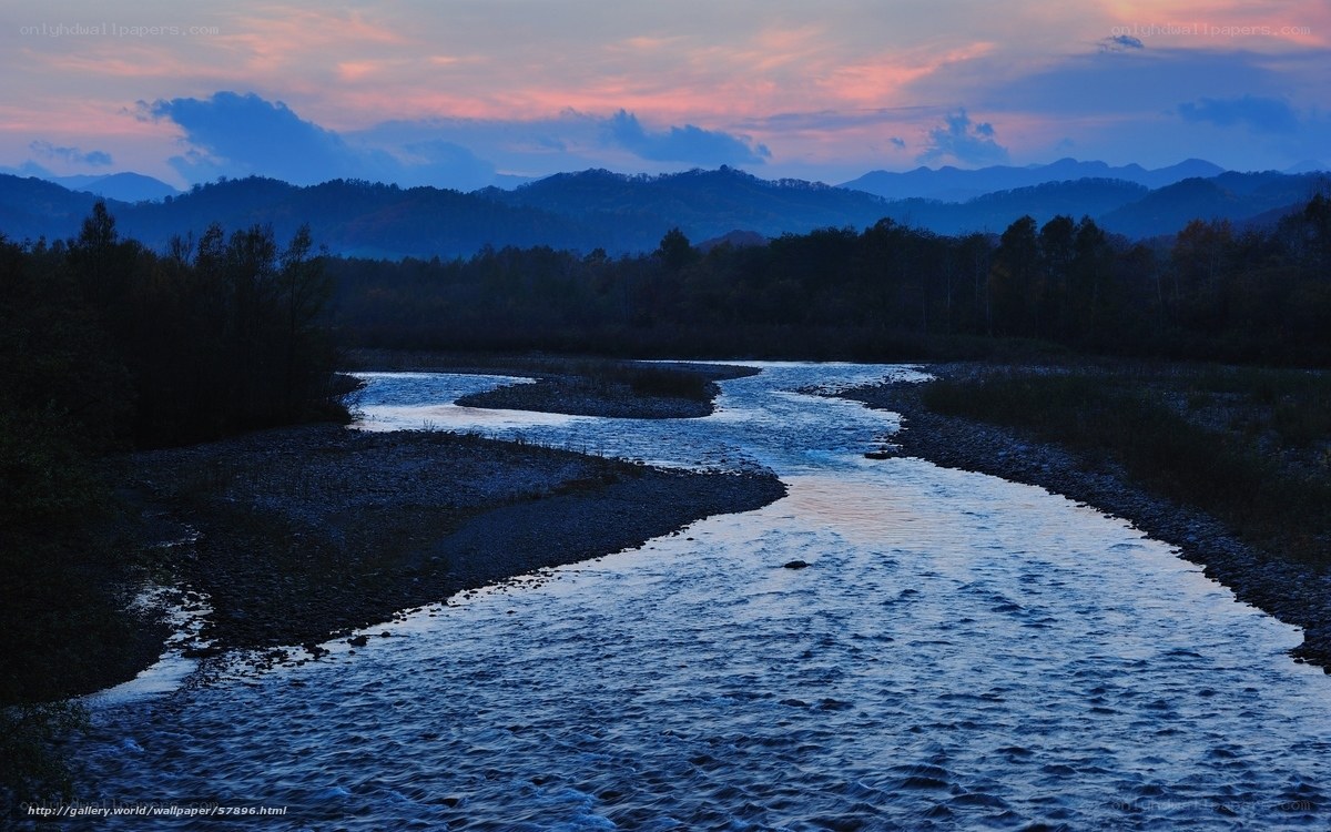 River at dusk with mountains