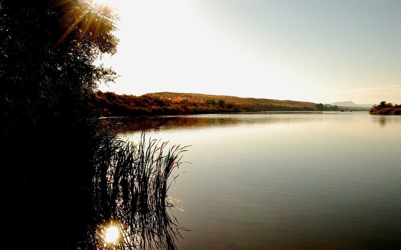 River at Sunset — Brown, Serene, Photograph, Trees, Hills