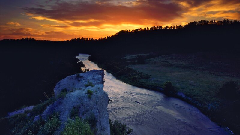 River at sunset in a valley