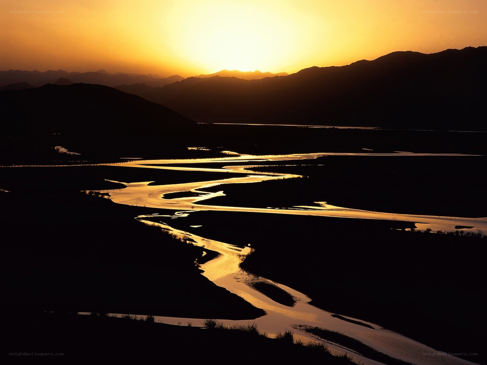 River at sunset in mountain valley