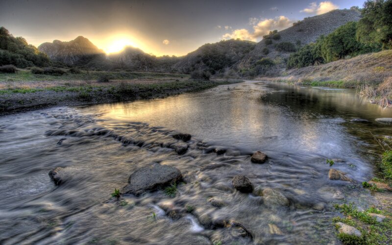 River at sunset in the hills