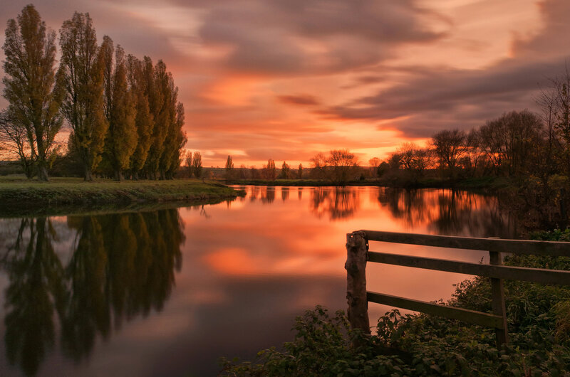 River at Sunset — Orange, Serene, Photograph, Trees, Fence