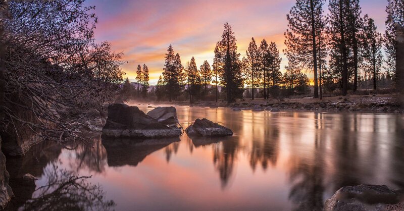 River at Sunset — Orange, Serene, Photograph, Trees, Rocks, Sky