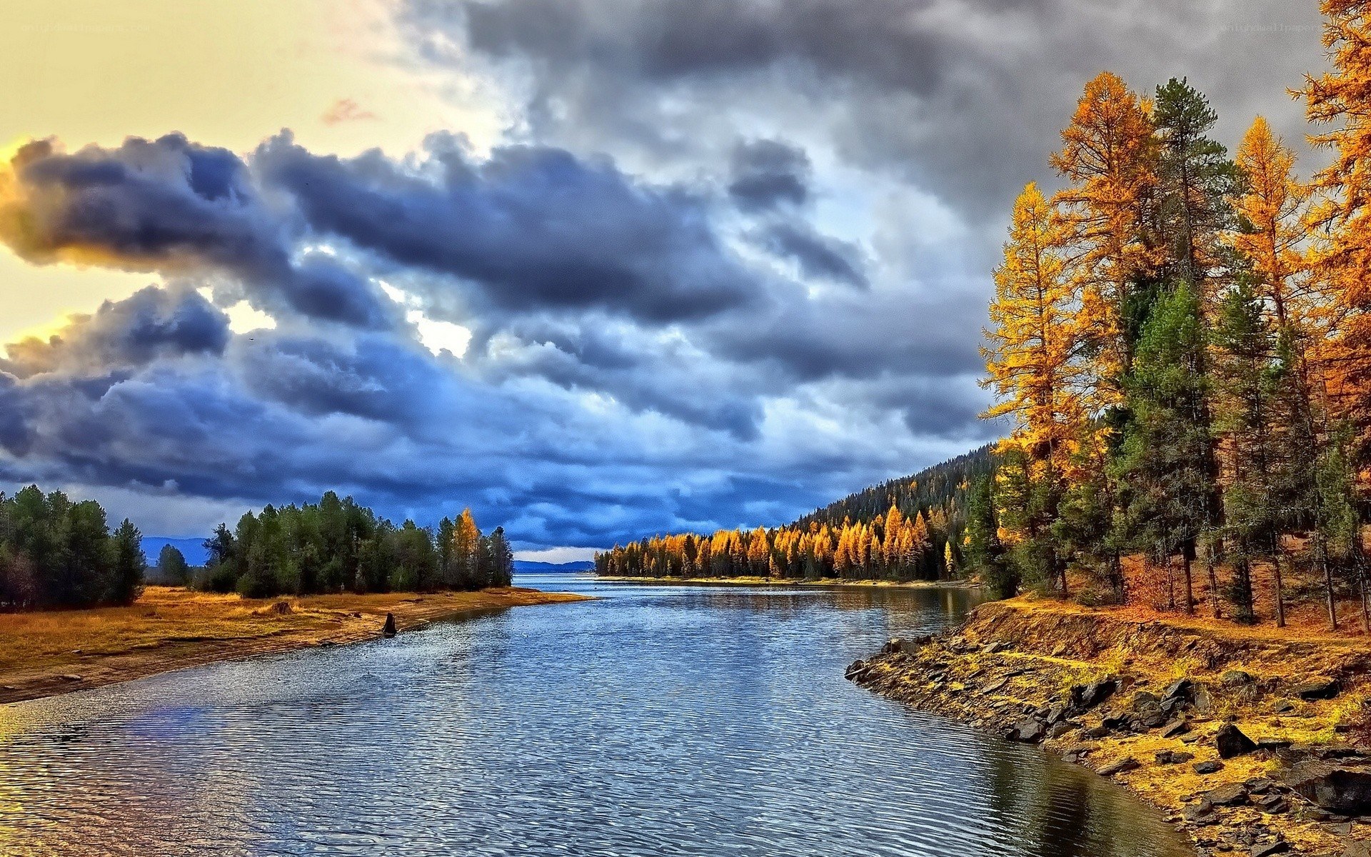 River at sunset with autumn trees