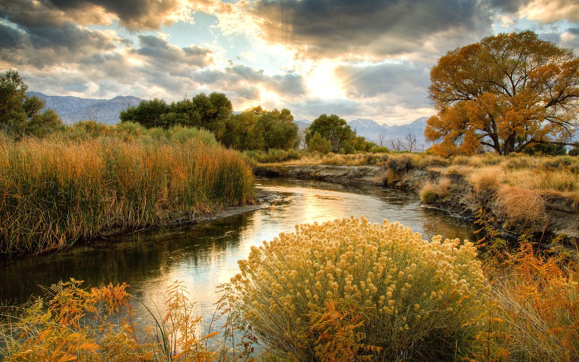 River at sunset with autumn trees