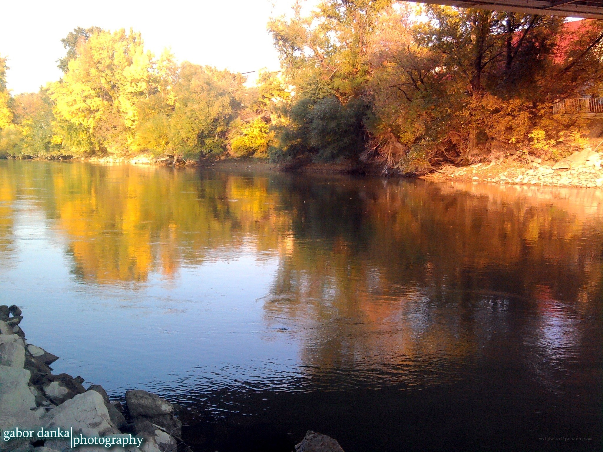 River at sunset with autumn trees