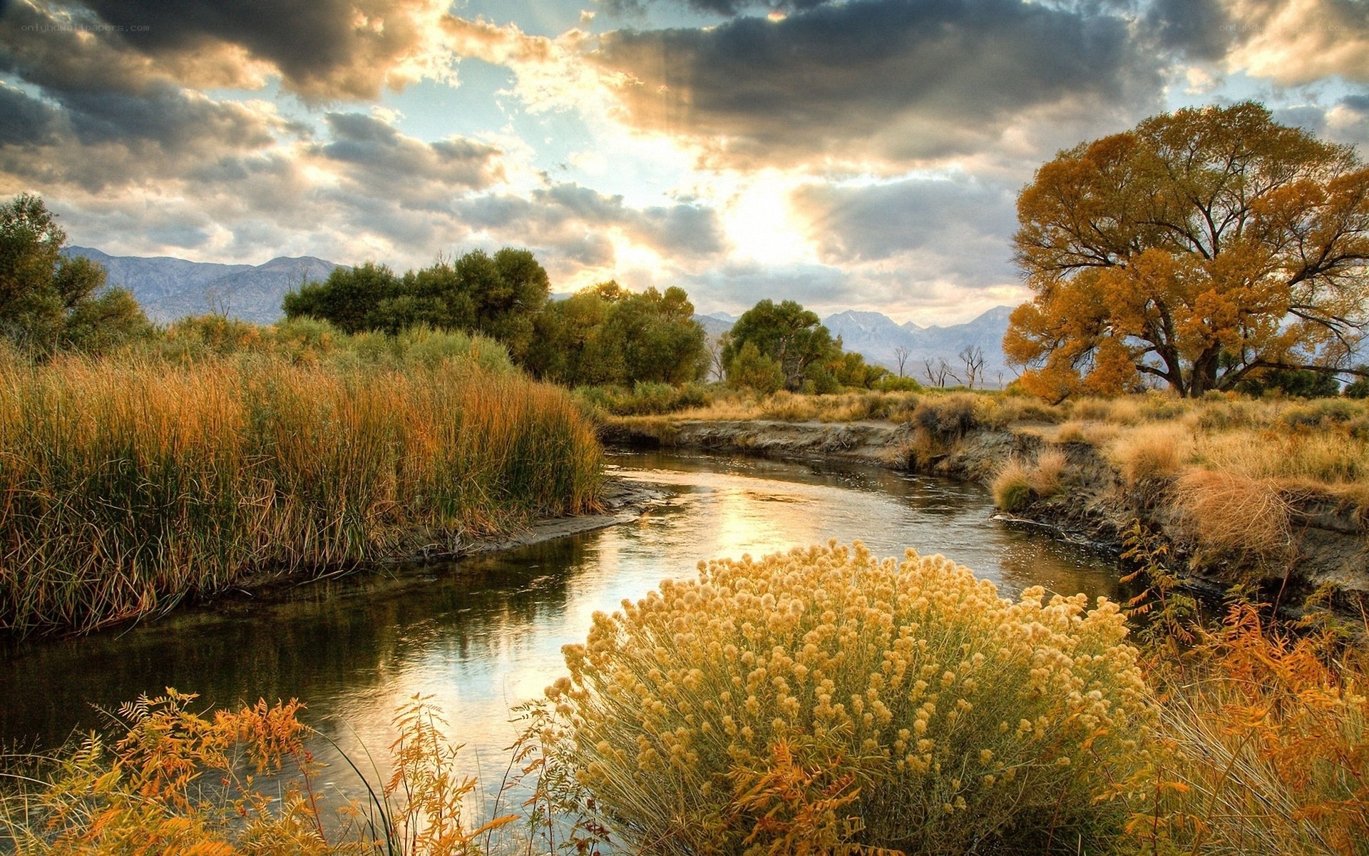 River at sunset with autumn trees
