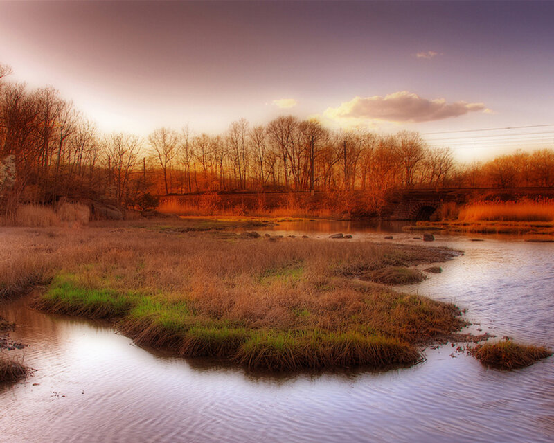River at sunset with bridge