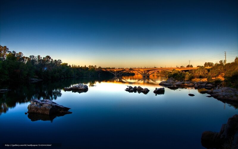 River at sunset with bridge