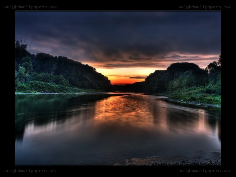 River at sunset with dramatic sky