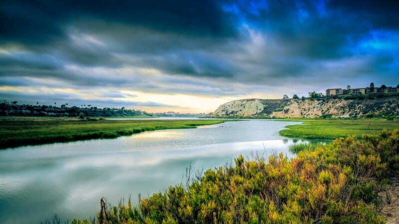 River at sunset with dramatic sky