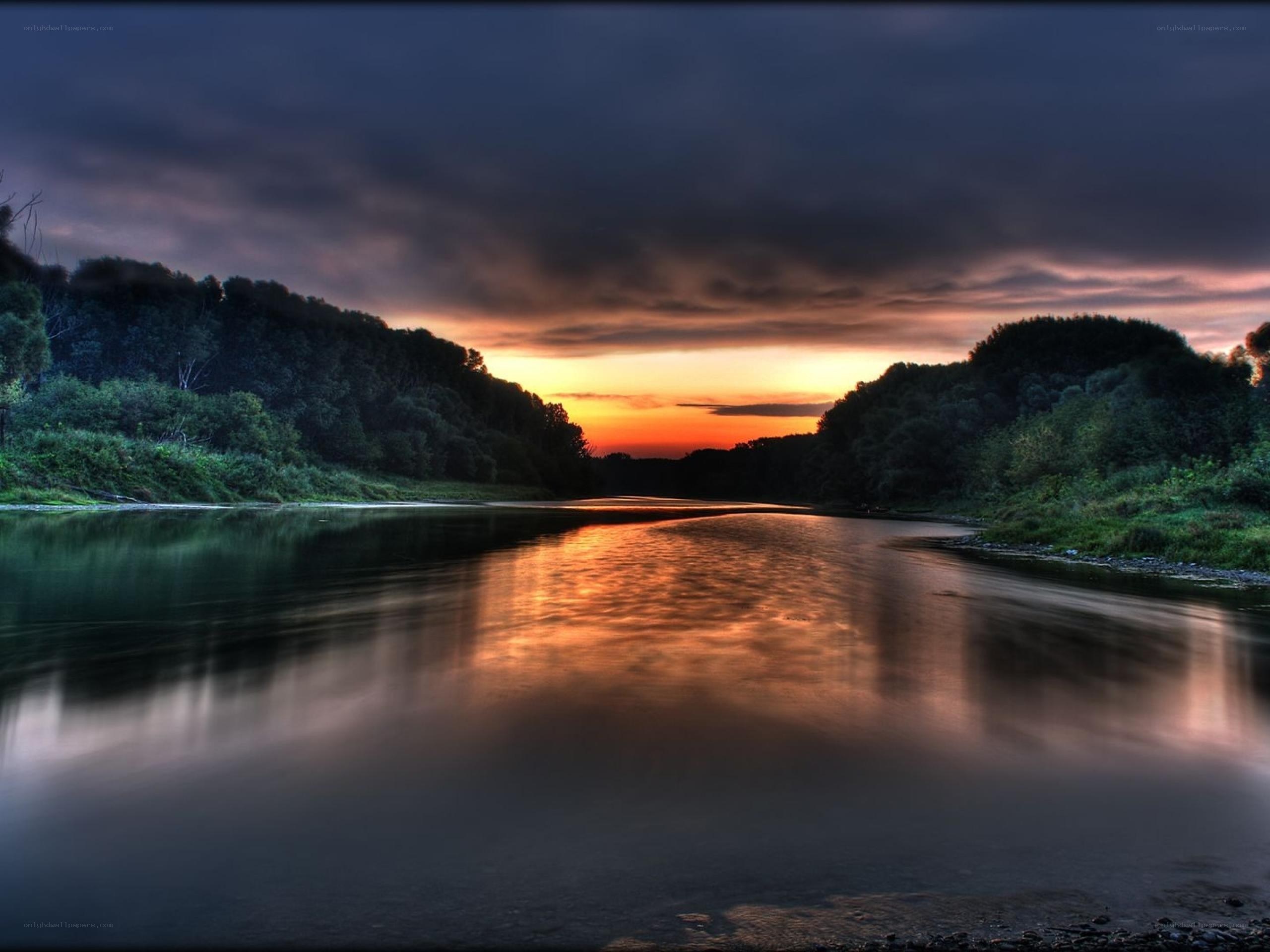 River at sunset with forest