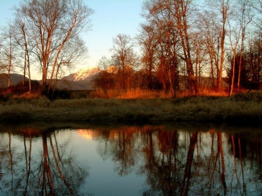 river at sunset with mountain view