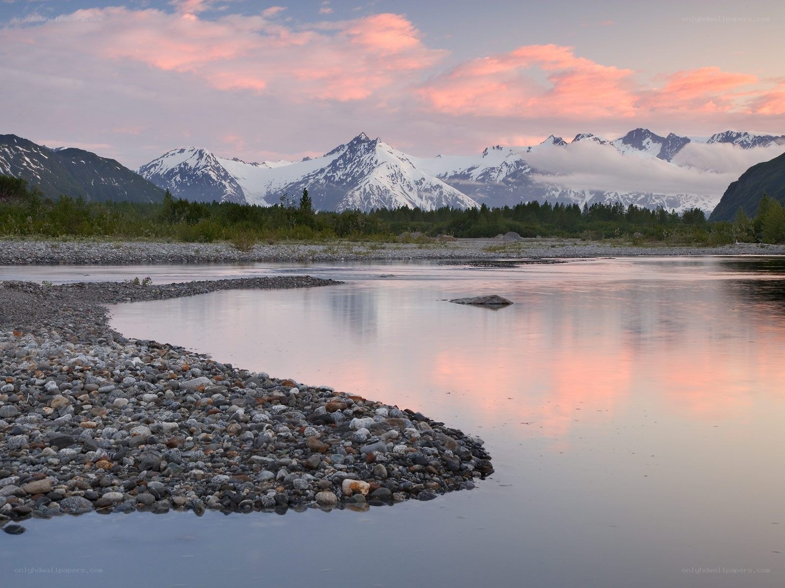 River at sunset with mountains