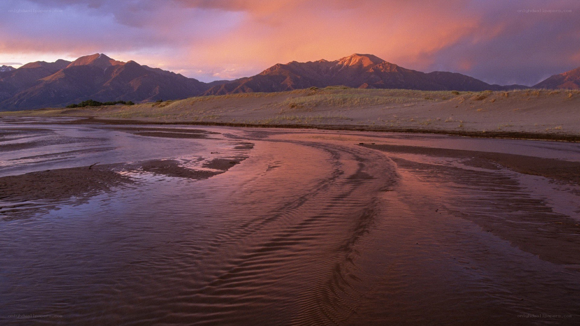 river at sunset with mountains