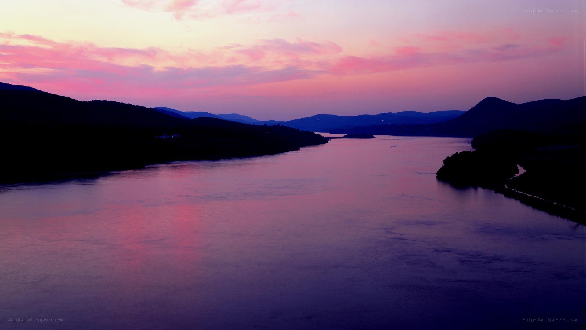 river at sunset with purple sky