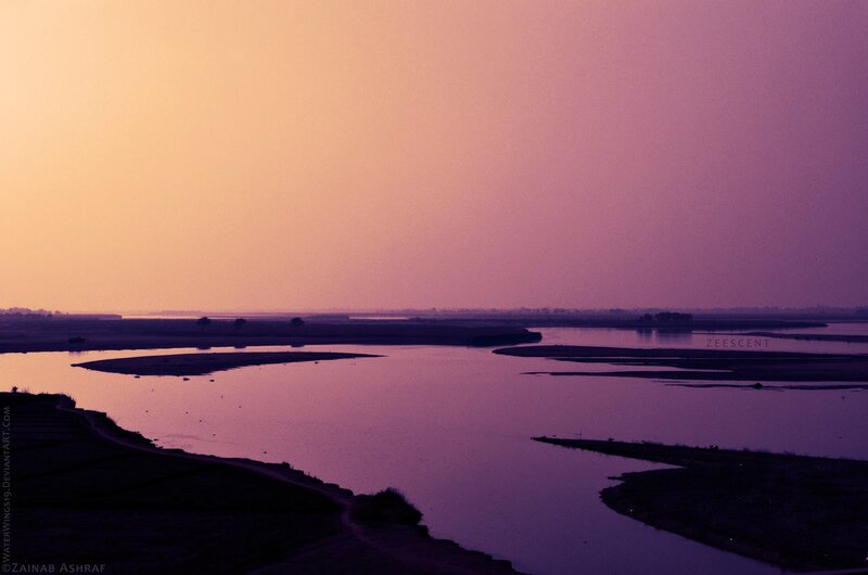 river at sunset with purple sky