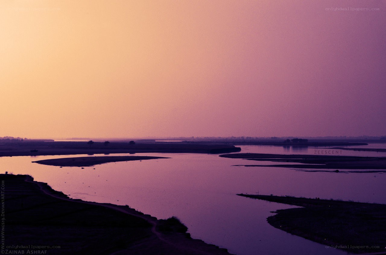 river at sunset with purple sky