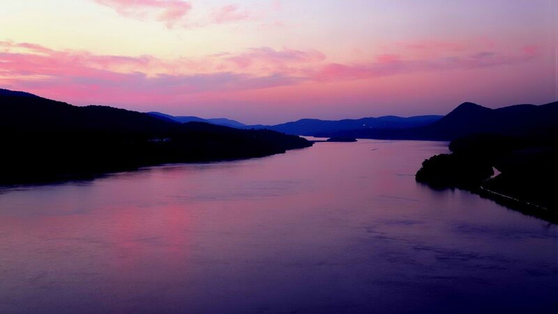 river at sunset with purple sky