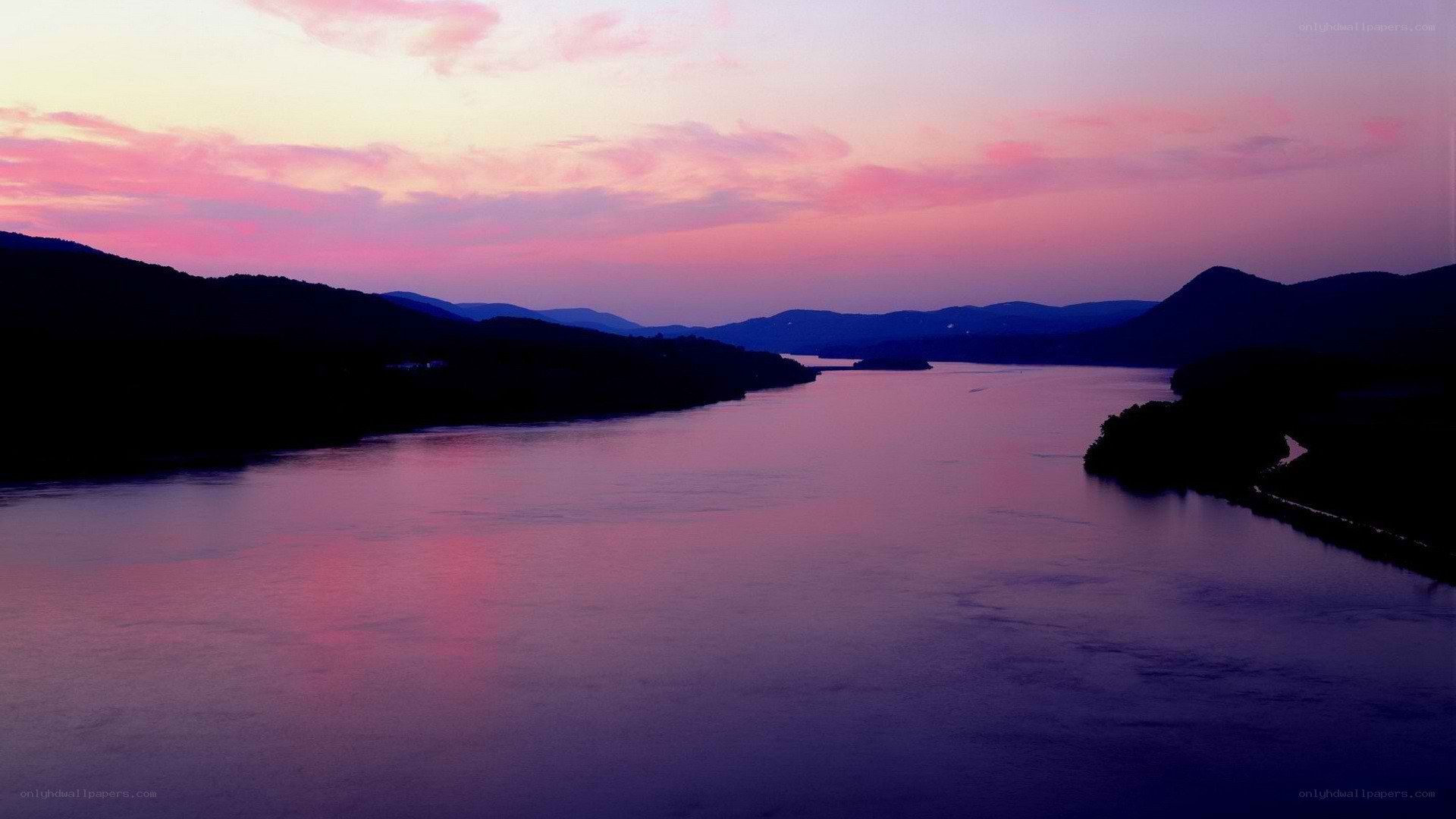 river at sunset with purple sky