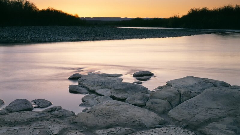 River at sunset with rocks