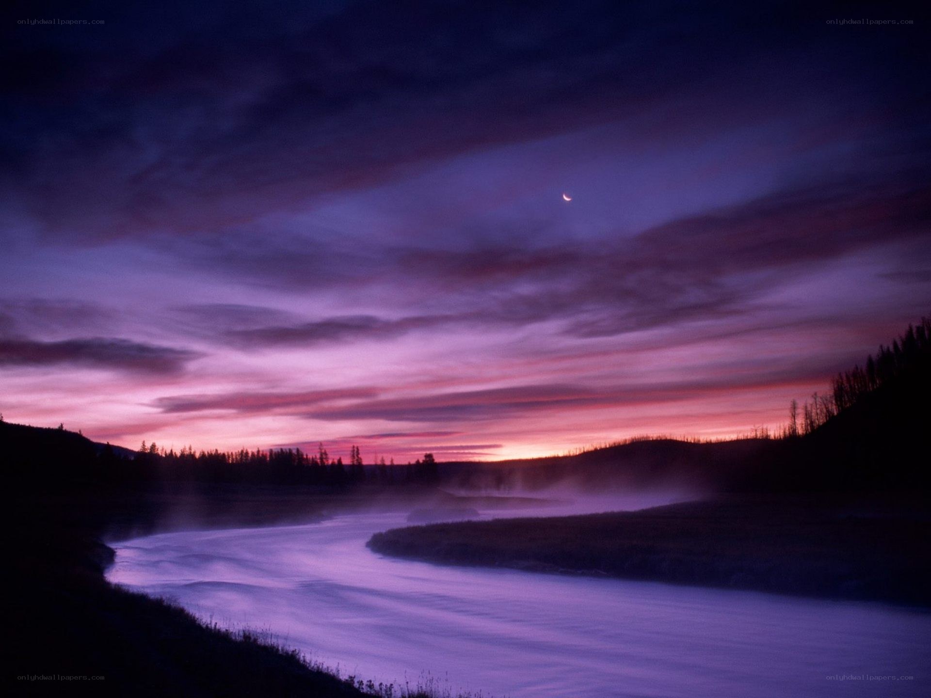 River at twilight with crescent moon