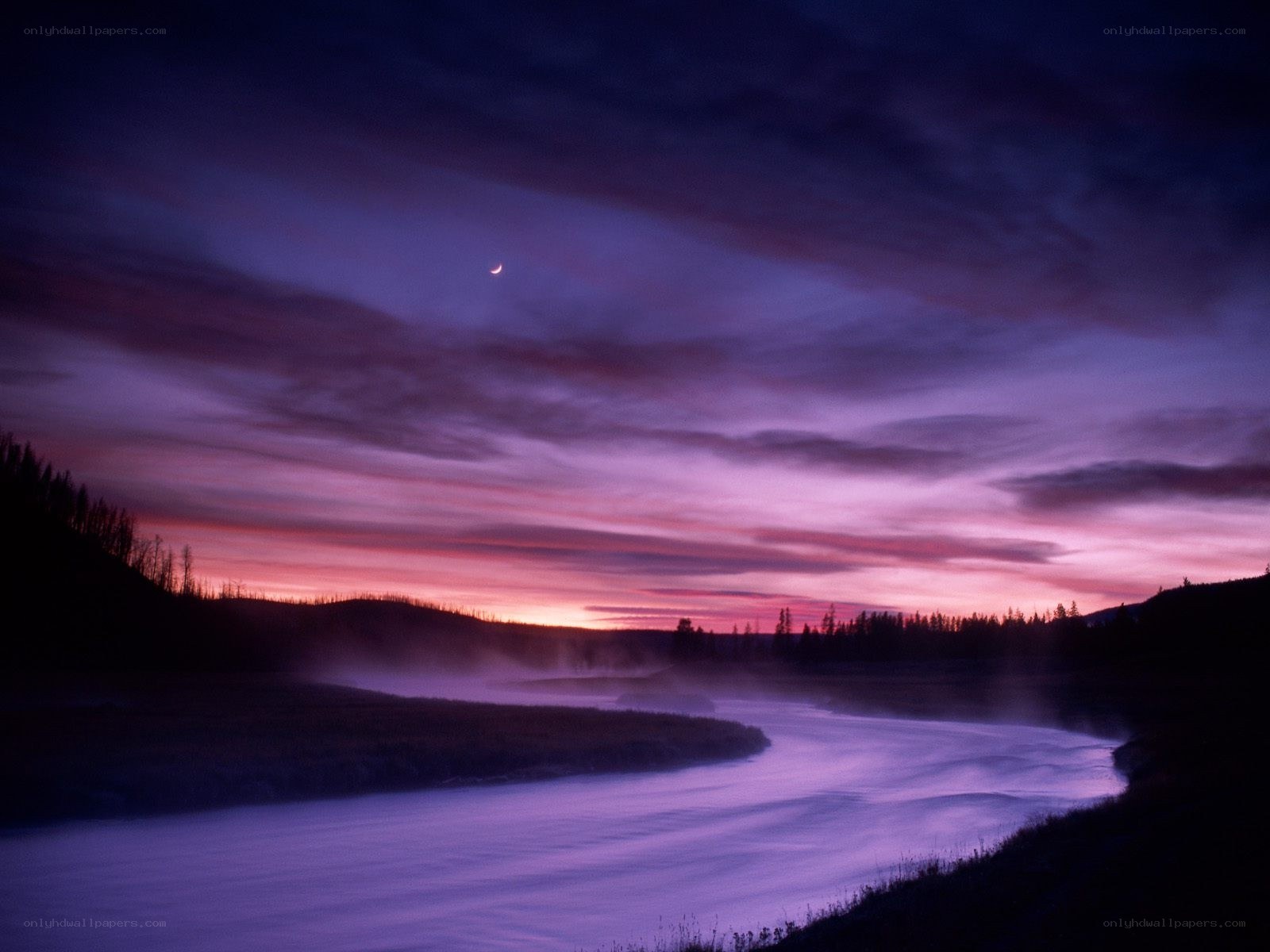 River at twilight with crescent moon