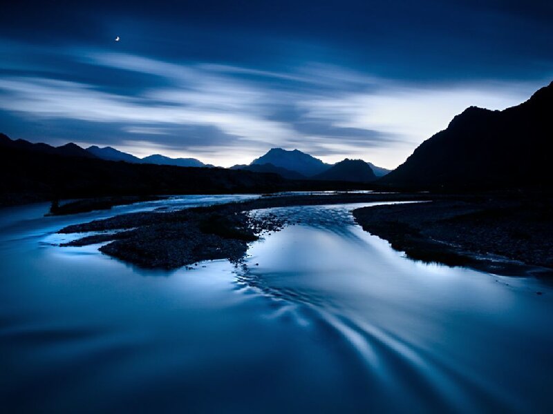 River at twilight with mountains