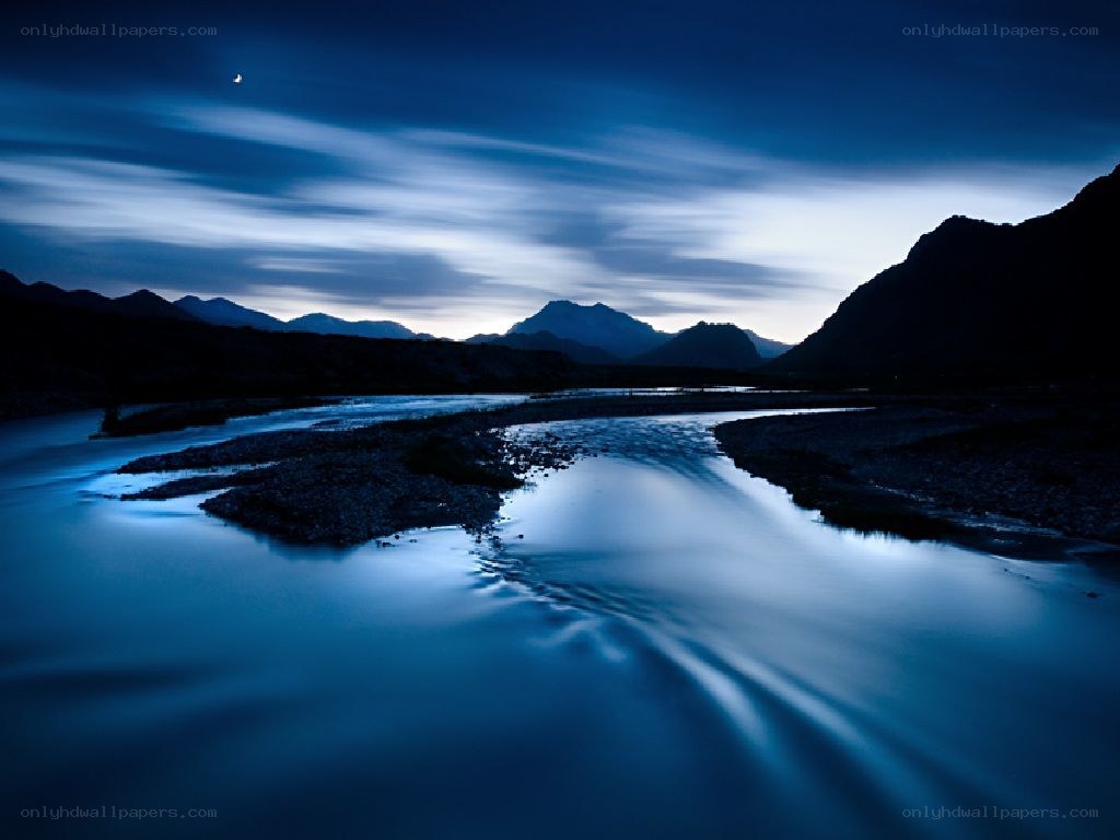 River at twilight with mountains