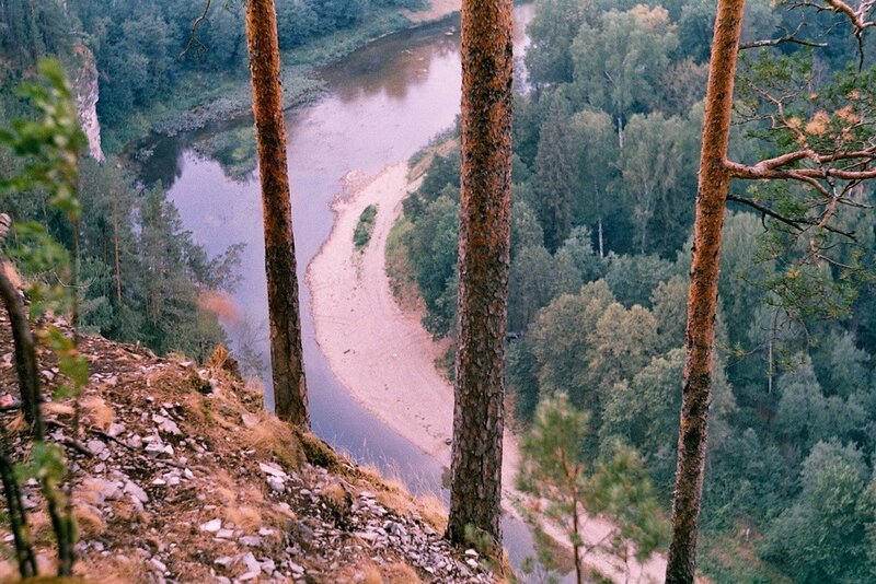 River bend from forested cliff