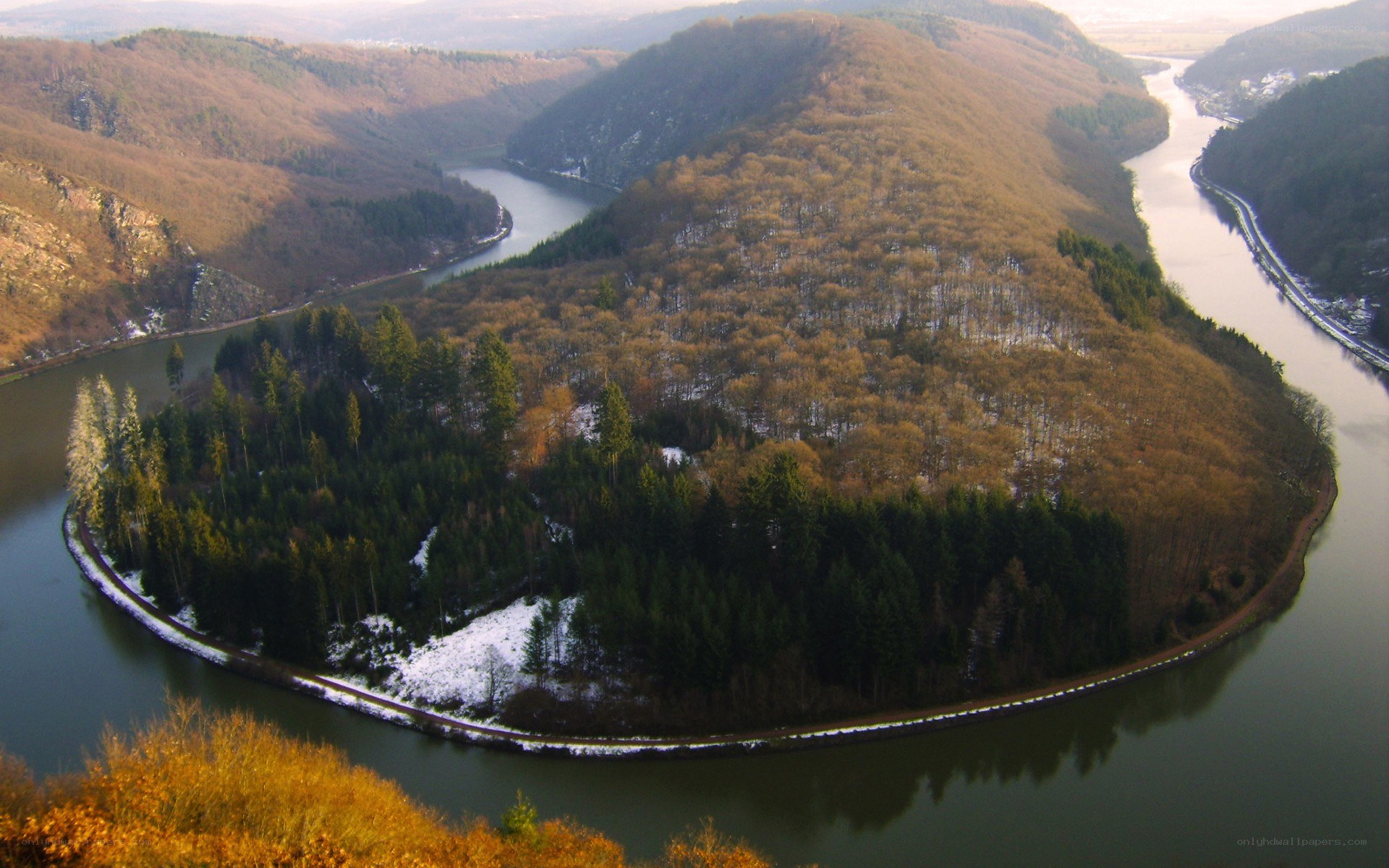 river bend in forested valley