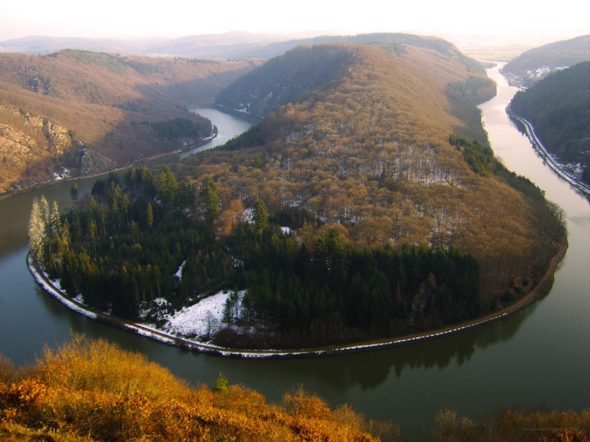 river bend in forested valley
