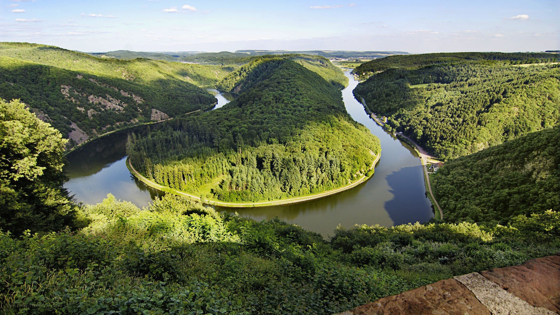 river bend in forested valley