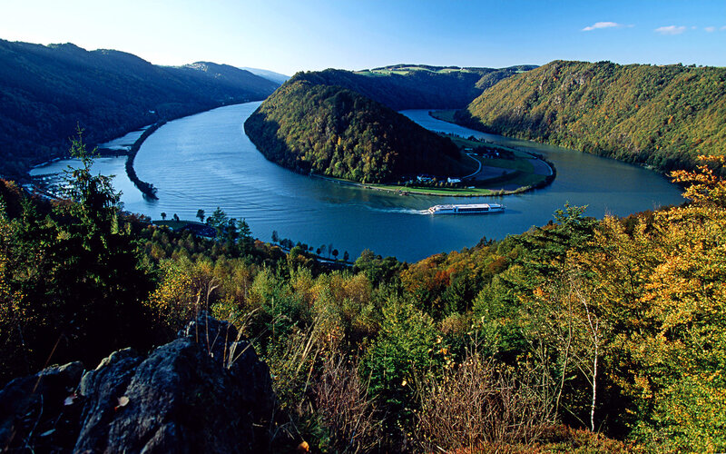 River bend with cruise ship