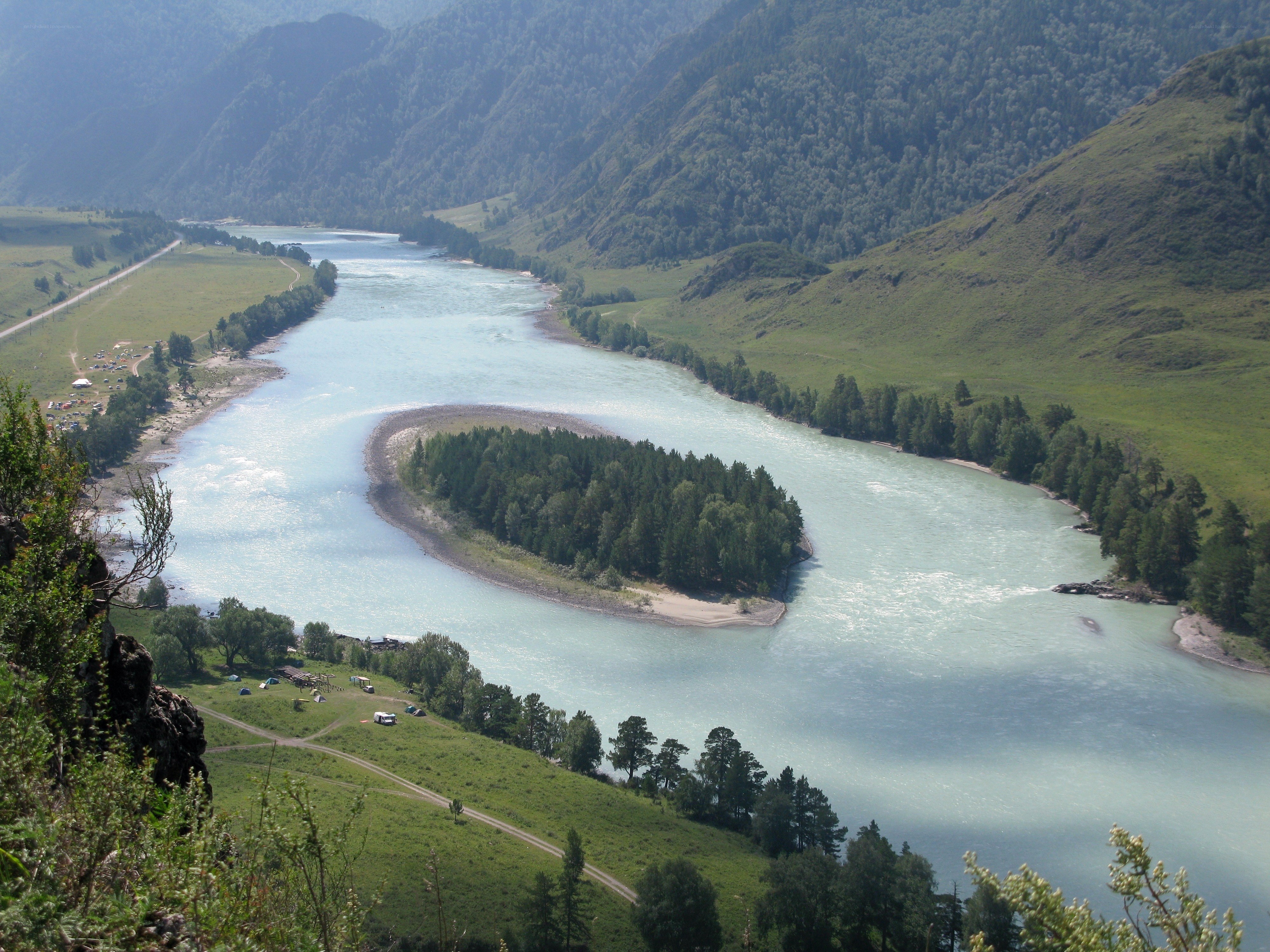 River bend with island in valley