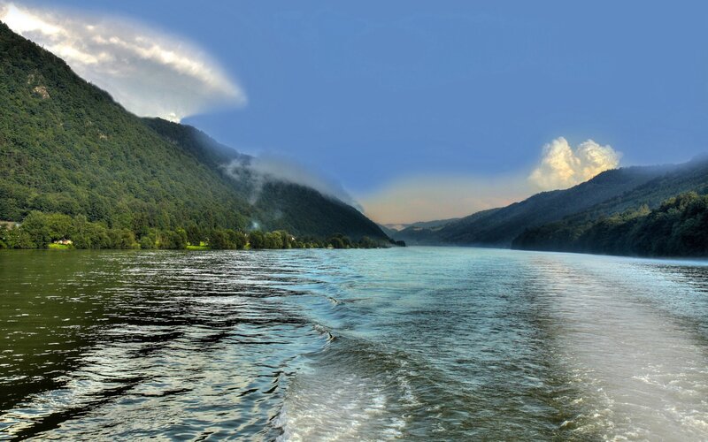 River between forested mountains